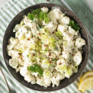cauliflower salad with mayo in a bowl.