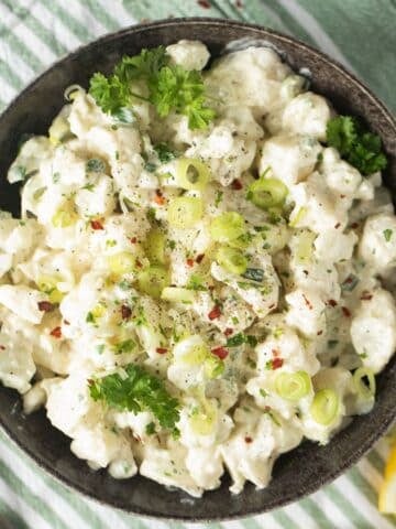 cauliflower salad with mayo in a bowl.