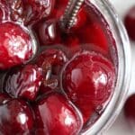 sweet cherries with sugar in a jar