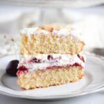 slice of cherry bakewell cake on a vintage platter