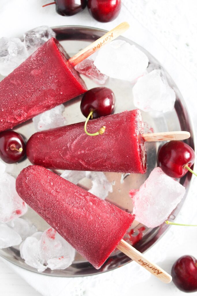 ice cherry popsicles on a silver platter