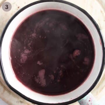 simmering cherry syrup in a small saucepan.