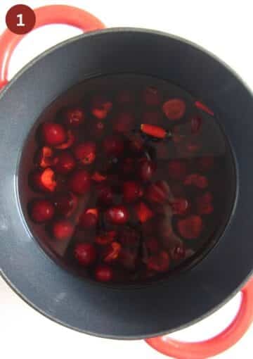 cherries, vinegar and flavorings mixed in a large pot for making cherry vinegar.