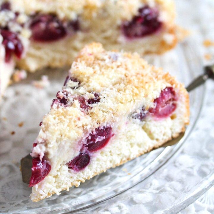coconut and cherry cake slice being served