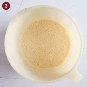 making the batter for cherry coconut cake in a large bowl.