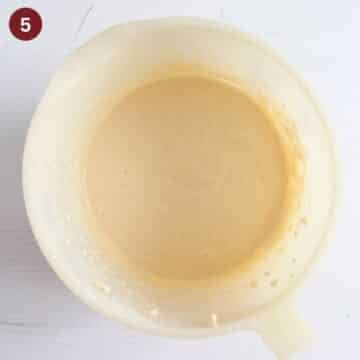 batter for coconut and cherry cake in a bowl.