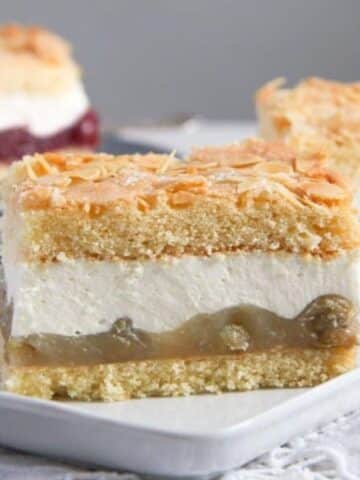 a rectangular piece of german gooseberry cheesecake on a platter.