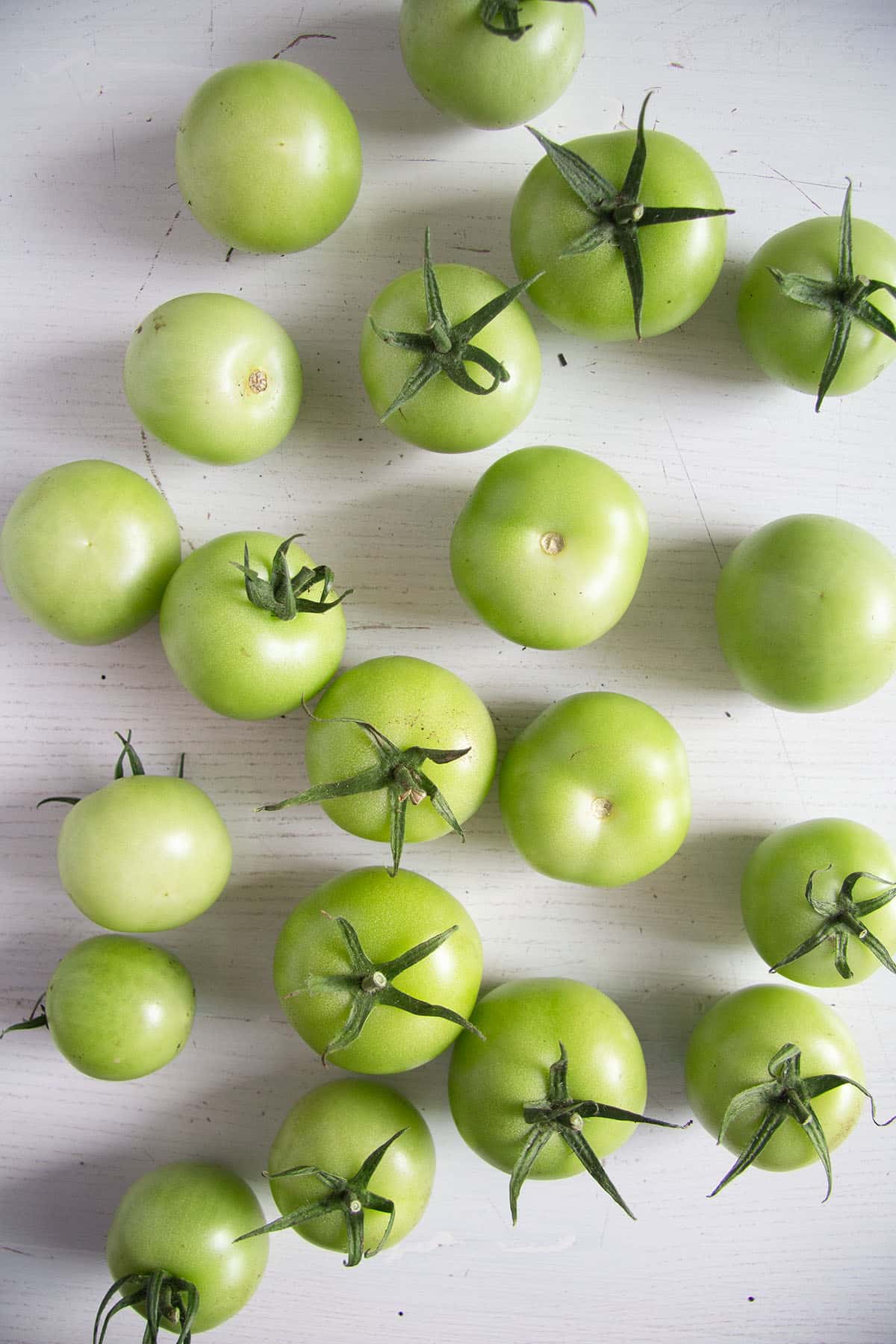 small green tomatoes on the table.