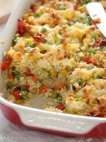 ham, cheese, and pasta bake in a casserole dish.