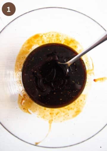 hoisin sauce for wings in a bowl with a spoon.