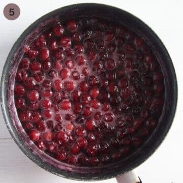cherries simmering in a large pot.