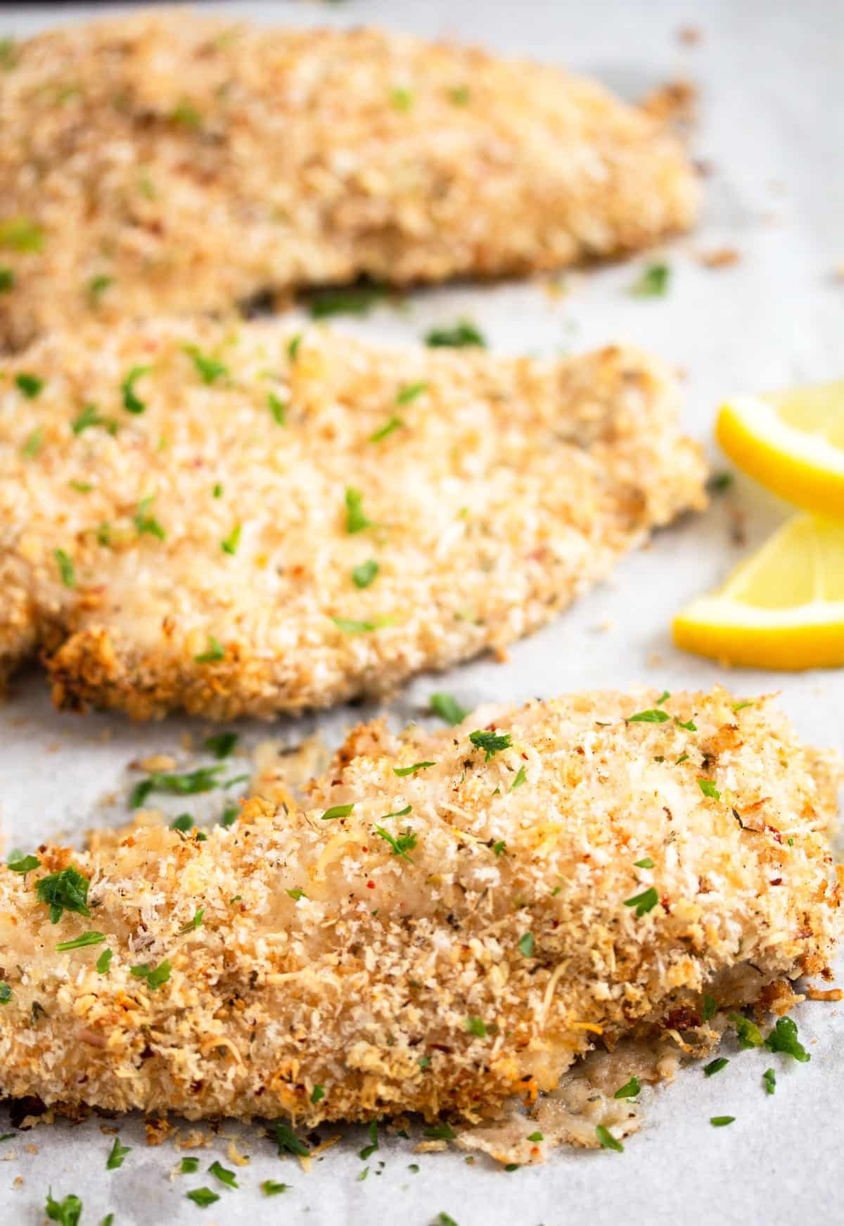 three breaded chicken breasts without eggs.