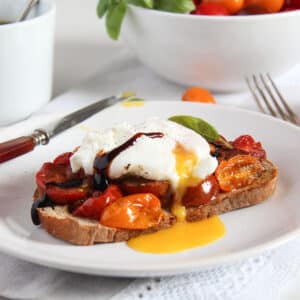 poached egg and tomato toast drizzled with balsamic.