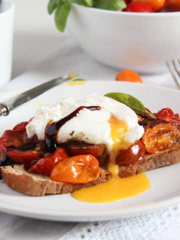 poached egg and tomato toast drizzled with balsamic.