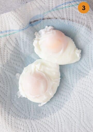 two poached egg draining on paper.