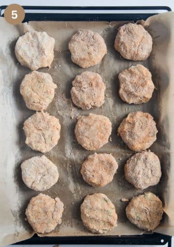 unbaked cauliflower potato patties on a baking sheet.