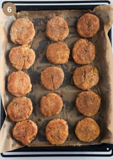 fifteen potato cauliflower patties on a baking sheet lined with parchment paper.