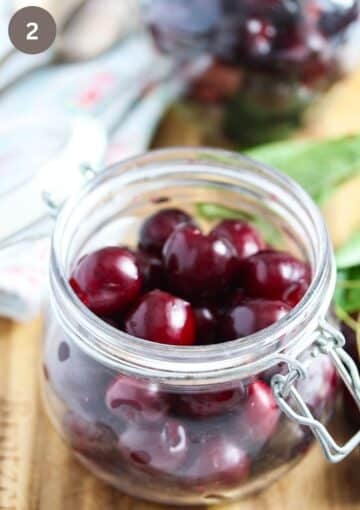 cherries in an empty jar.
