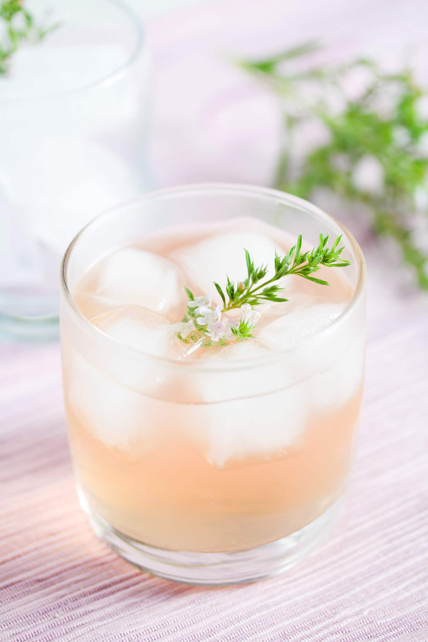 gin flavored with rhubarb and ginger served on ice