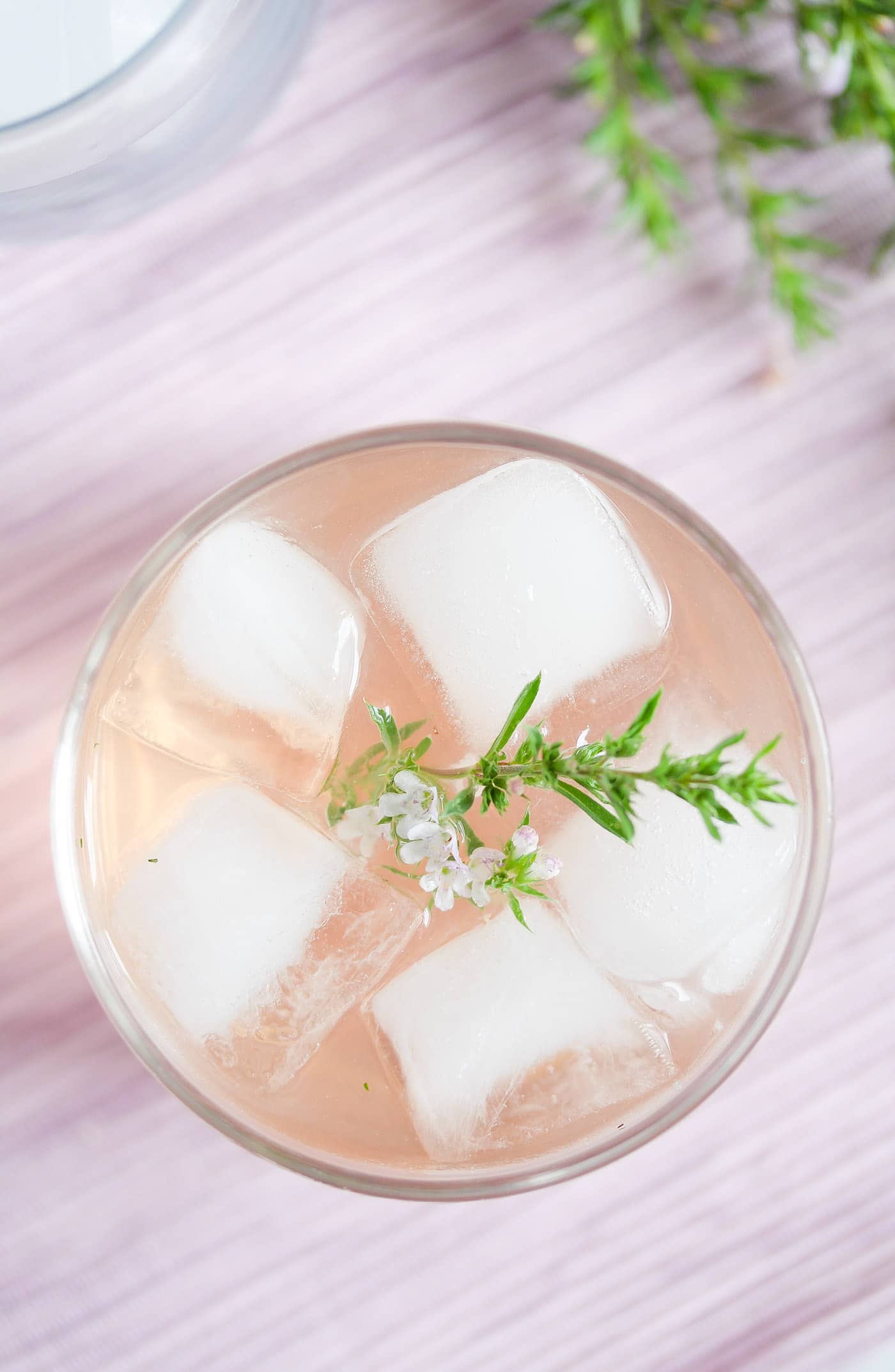 glass of alcoholic drink on ice seen from above