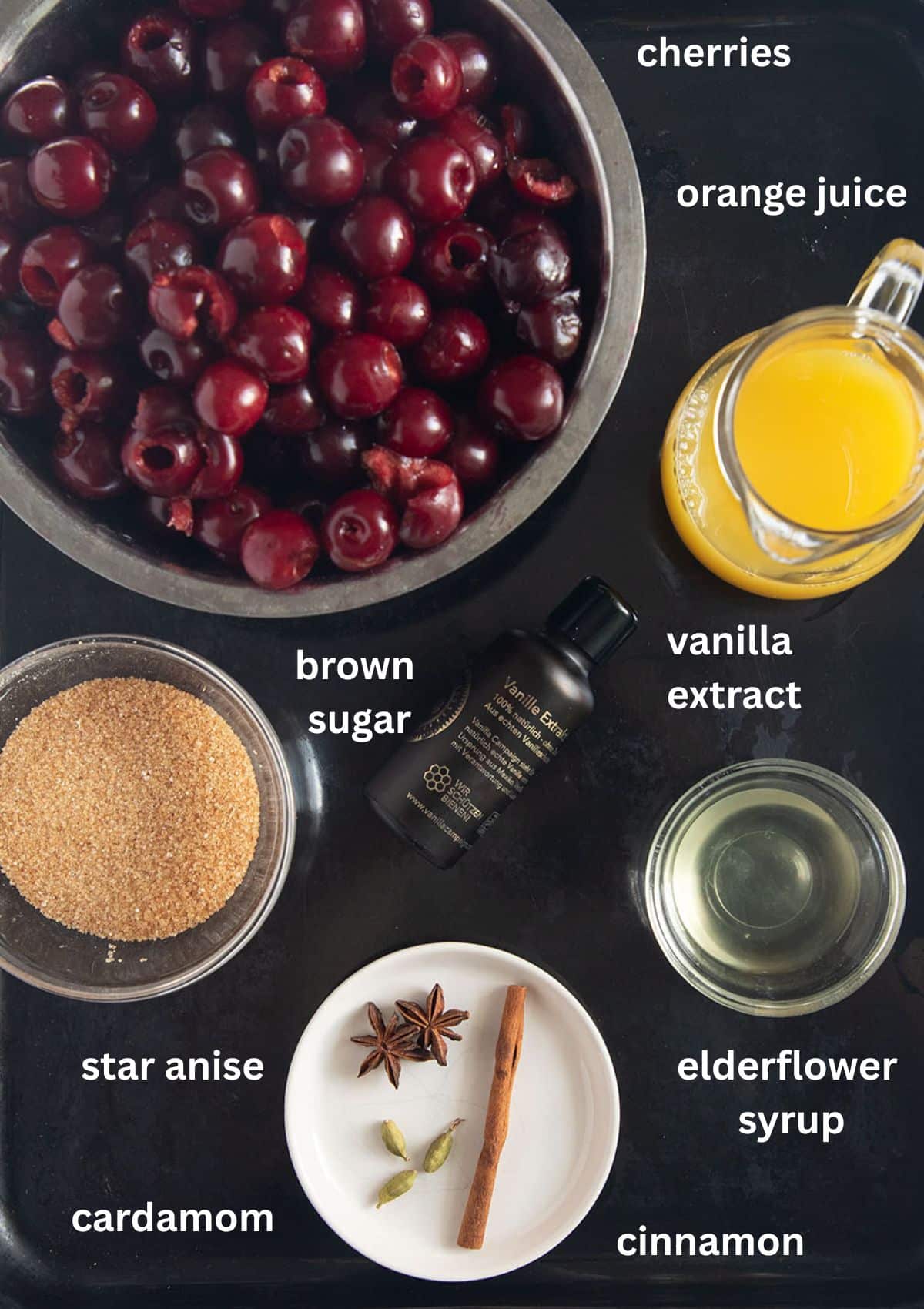 labeled ingredients for roasting cherries with orange and elderflower juice, brown sugar, spices, and vanilla.