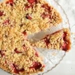 pinterest image with title for strawberry and rhubarb tart with crumbles.