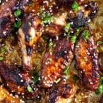 hoisin chicken wings sprinkled with sesame seeds.