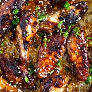 hoisin chicken wings sprinkled with sesame seeds.