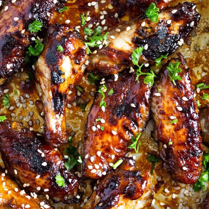 sweet and spicy chicken wings sprinkled with sesame seeds.