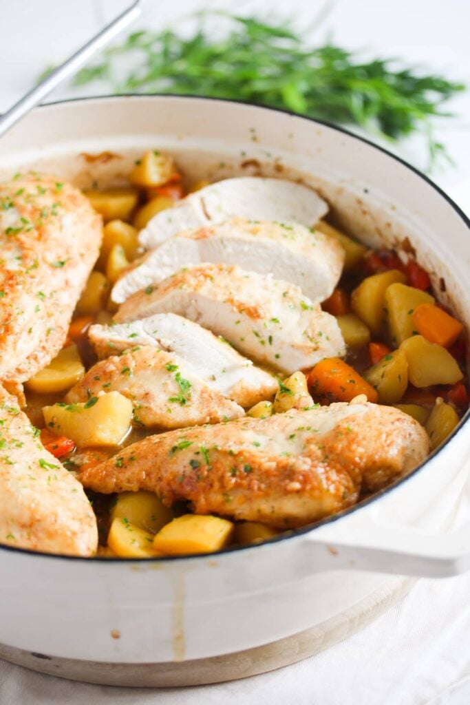 chicken breast, potatoes and vegetables cooked in a dutch oven
