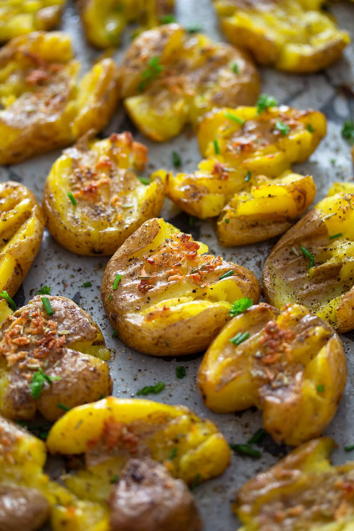 golden crispy smashed fingerling potatoes with garlic and rosemary.