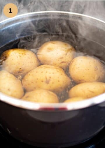 boiling potatoes in a steaming pot of water.