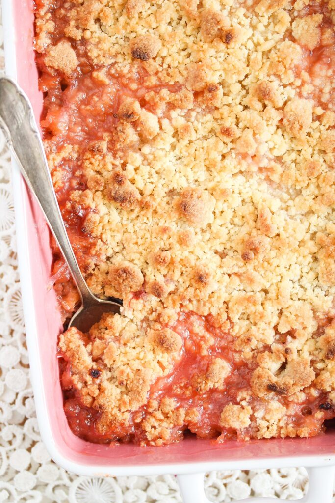 crumble recipe with tart berries in a pink baking dish