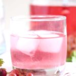 glass with pink gin on a cloth