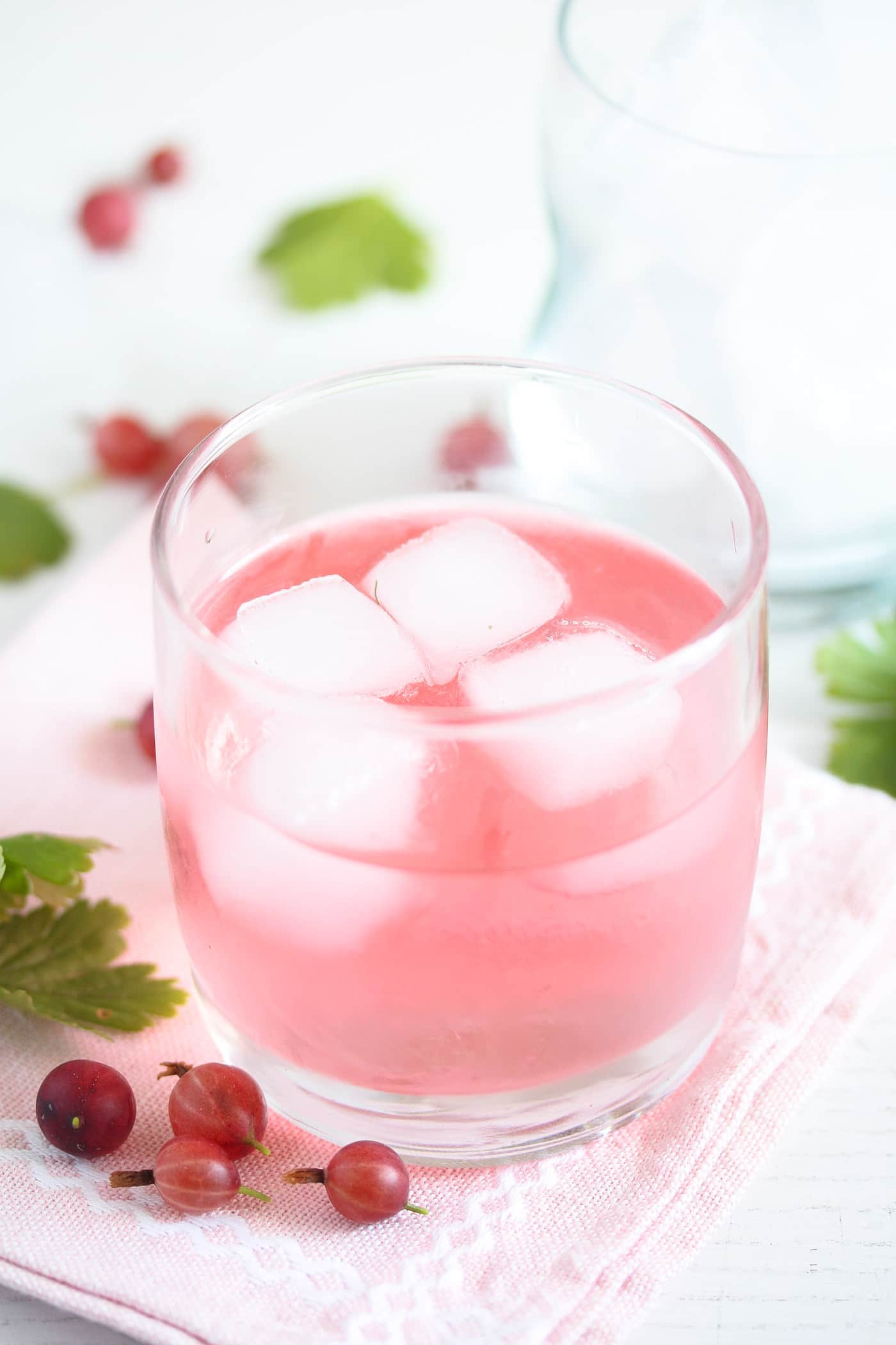 floating ice cubes in a glass of flavored gin