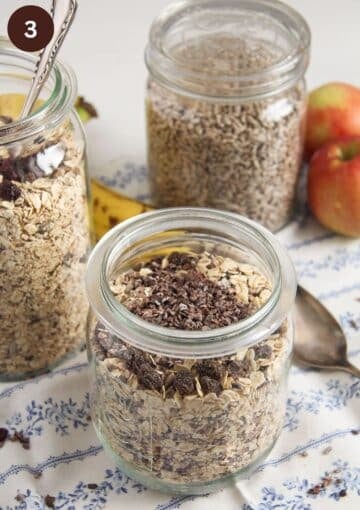 jars with homemade muesli mixture and one large jar full of sunflower seeds.