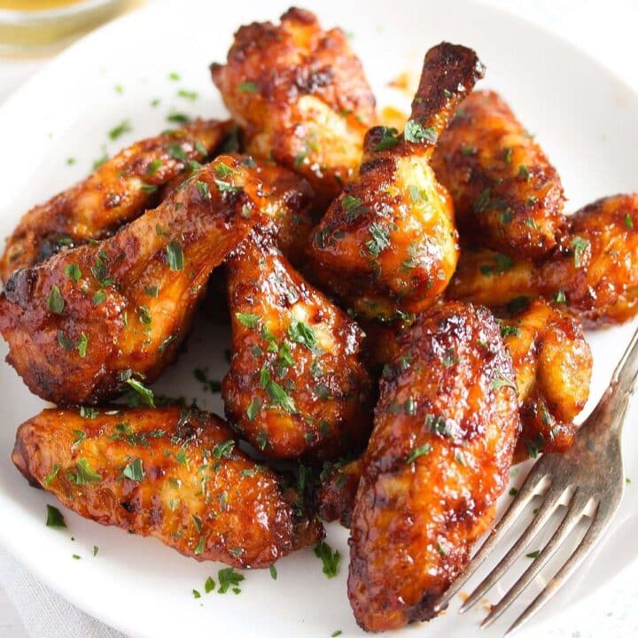 air fryer frozen chicken wings cooked and on a plate