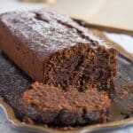 sliced chocolate and breadcrumb cake on a platter.
