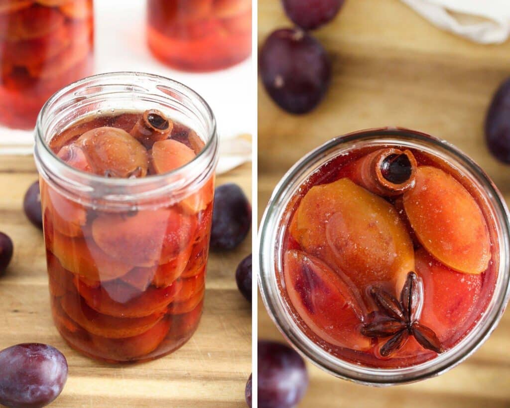 jars of preserved plums on a wooden board