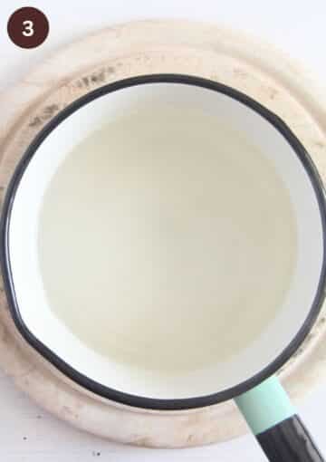 sugar and water mixture in a saucepan needed to add to plums for canning.