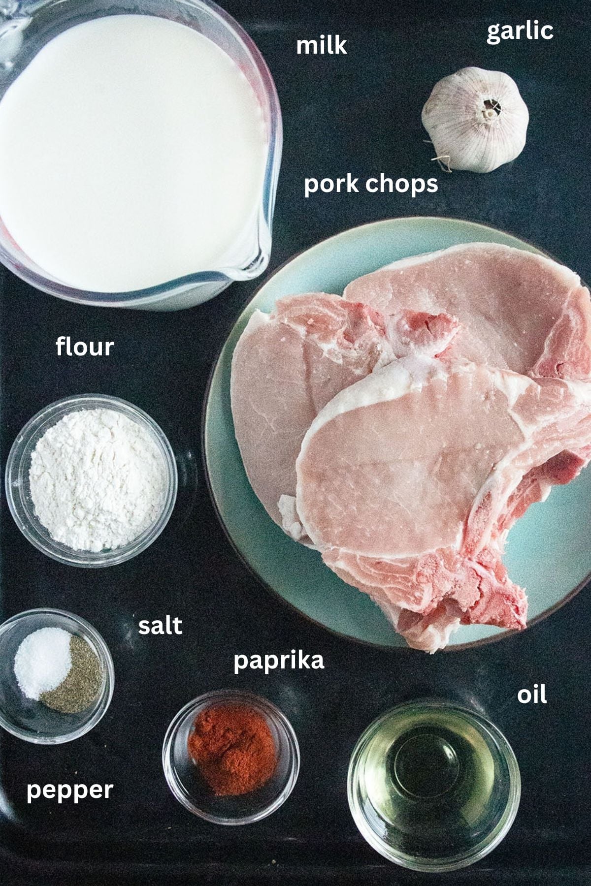 labeled ingredients for making pork chops with milk marinade and garlic.