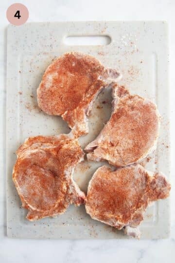 seasoning brined chops with paprika, salt and pepper.