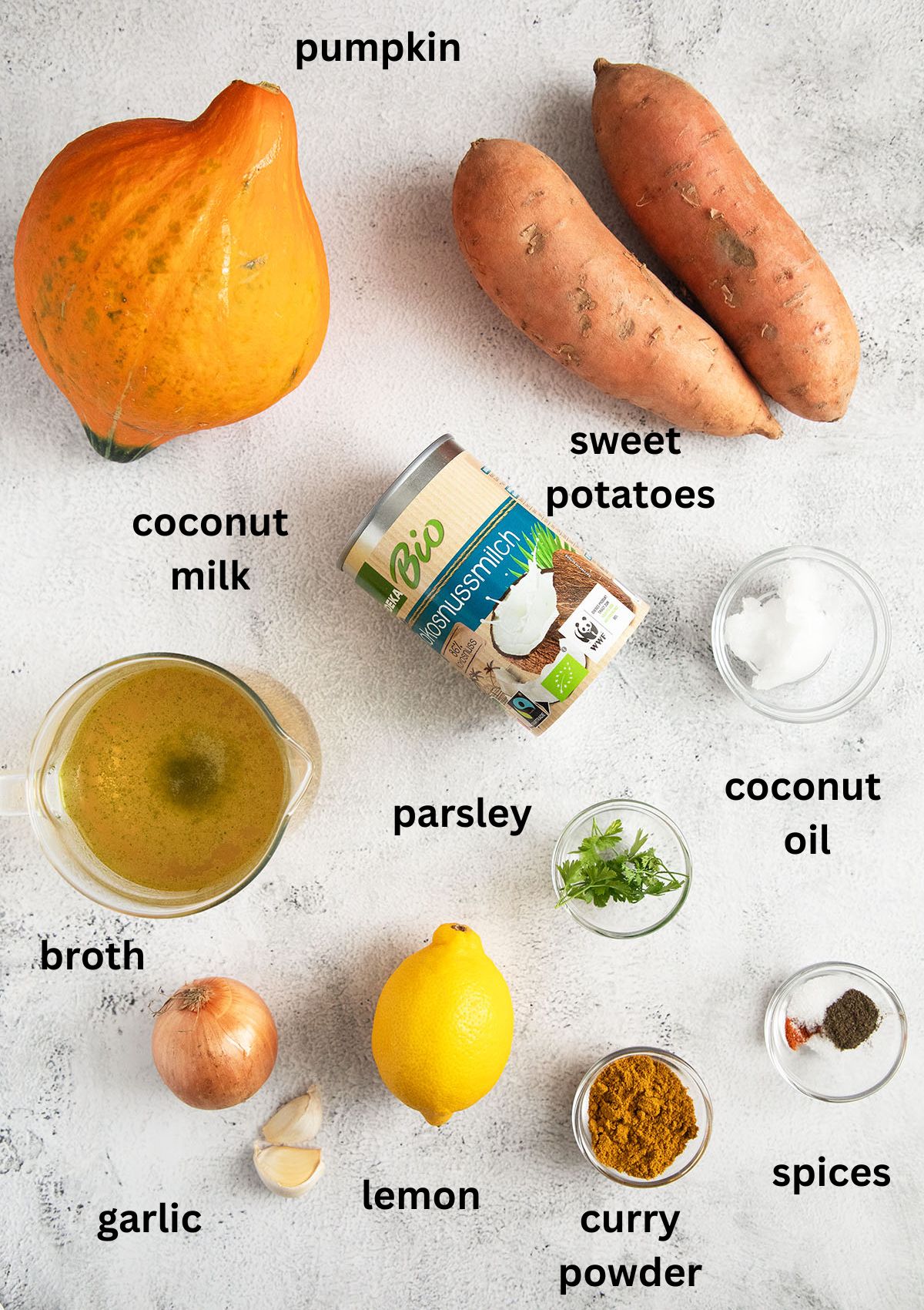 listed ingredients for making sweet potato and pumpkin soup with coconut milk and curry.
