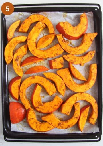 roasted pumpkin slices on a large baking sheet.