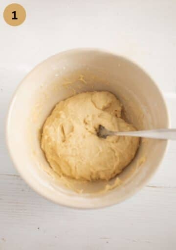 stirring dough for pie in a bowl with a spoon.