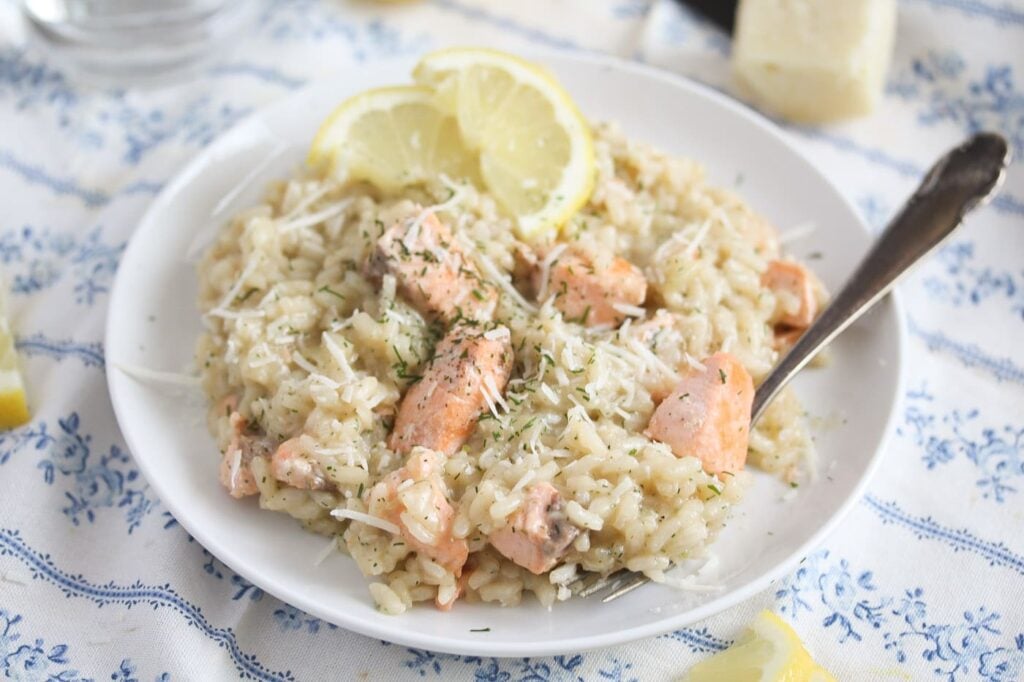 risotto with fish and dill on a white plate