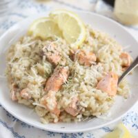 risotto with fish and dill on a white plate