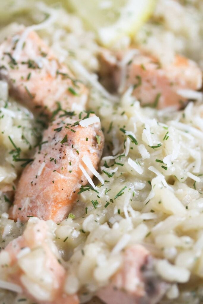 close up salmon and rice pieces sprinkled wiht parmesan