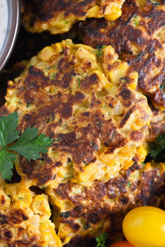 close up of one zucchini cake with corn
