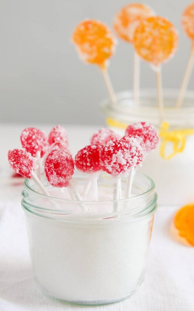 small red lollipops coated with prickly coating